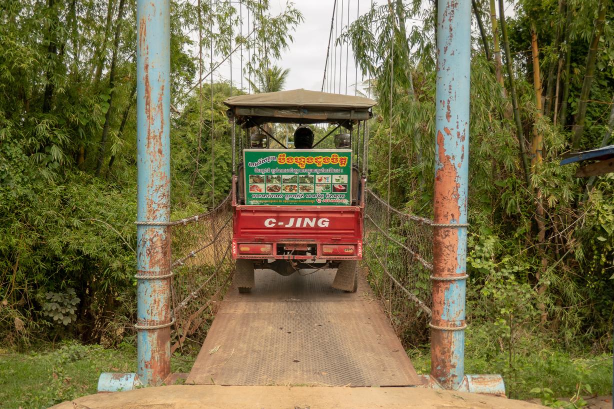 Crossing a narrow bridge on our Battambang Tuk Tuk Tour