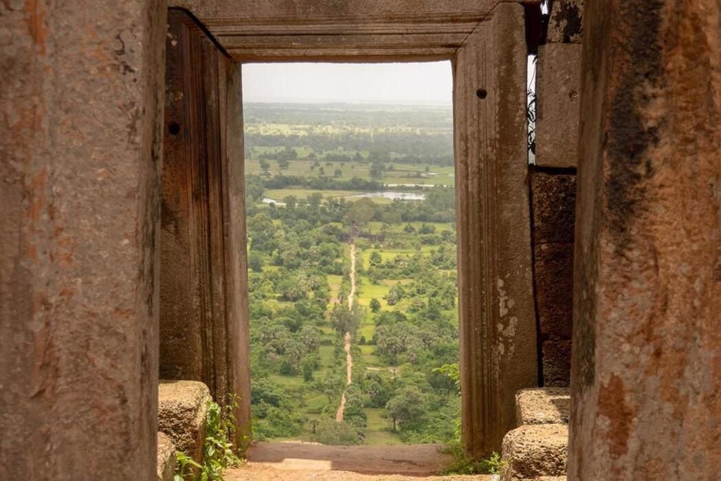 Dry Season in Cambodia - a beautiful view through the window of a mountain temple