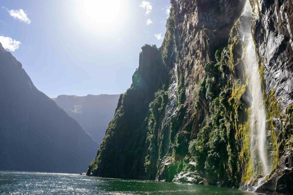 Waterfall and cliff face at Milford Sound