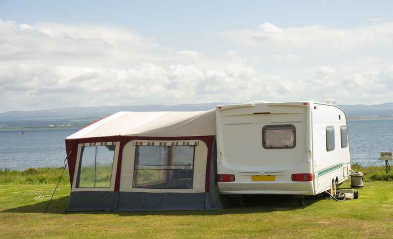 Caravan with a tent touring Europe