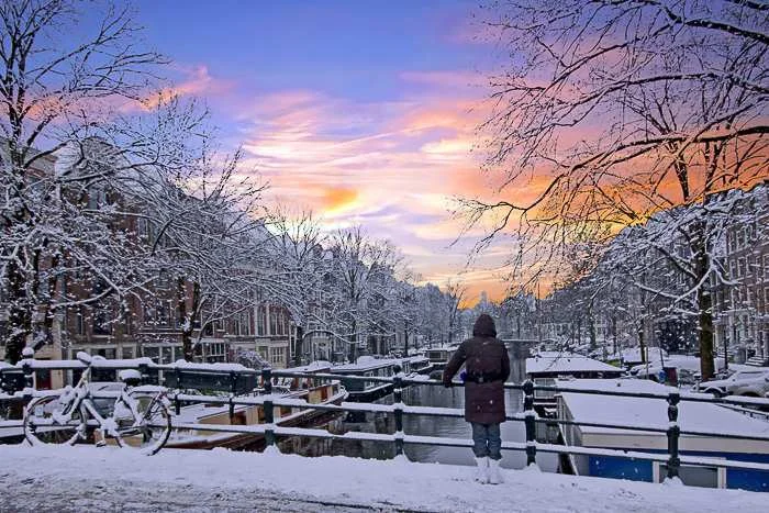 visit the Netherlands in winter for frozen canals and  ice skating
