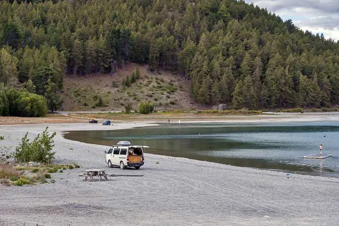 Parking a campervan by a lake in New Zealand